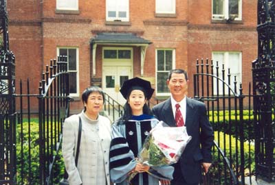 Elsa Yan and her parents at the graduation ceremony of Columbia University (2000)