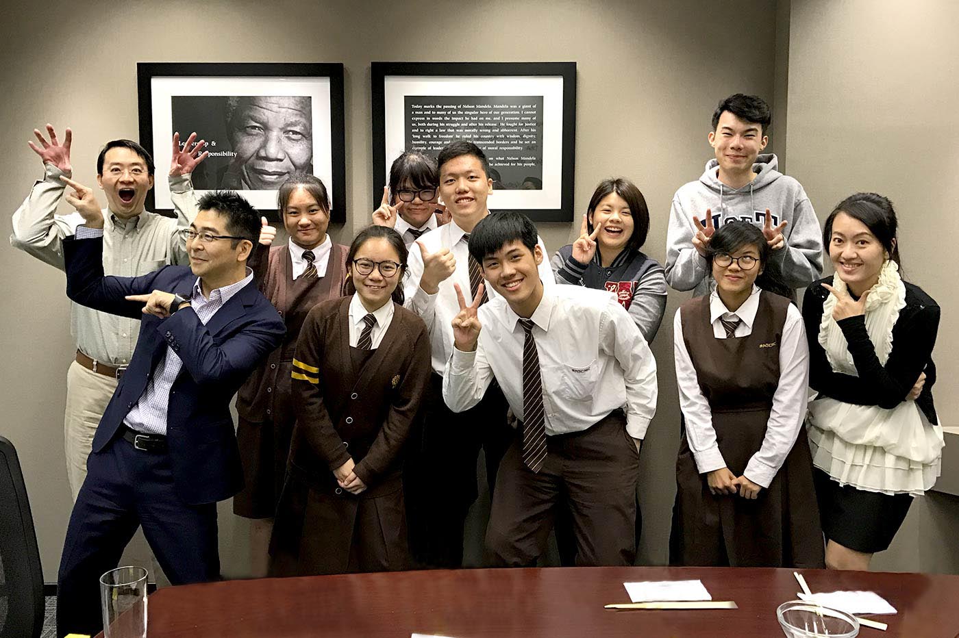 Students interacting with English-speaking staff of a hedge fund firm