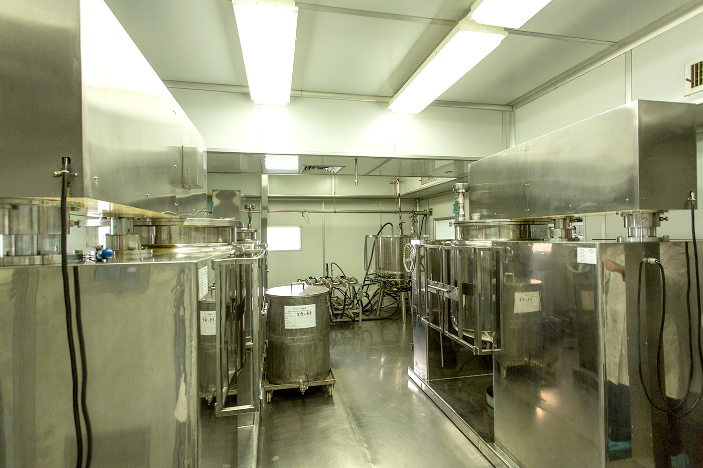 Ingredients are processed in the manufacturing room into well-mixed liquid