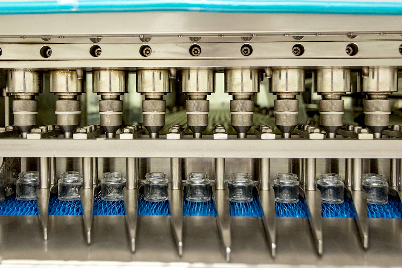 Solvents are injected into glass bottles through a filling machine